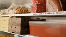 Ingredients stacked on the shelves in the Pompeii Pizza cold room