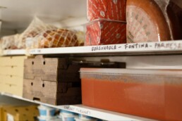 Ingredients stacked on the shelves in the Pompeii Pizza cold room