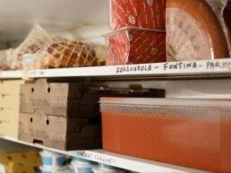 Ingredients stacked on the shelves in the Pompeii Pizza cold room