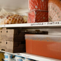 Ingredients stacked on the shelves in the Pompeii Pizza cold room