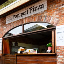 Pompeii Pizza customer service counter in day-light with no people