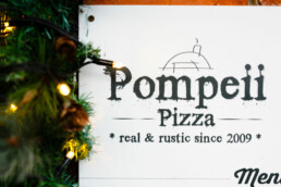 Pompeii Pizza gift vouchers surrounded by Christmas lights