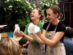learning to stretch dough at a pizza workshop